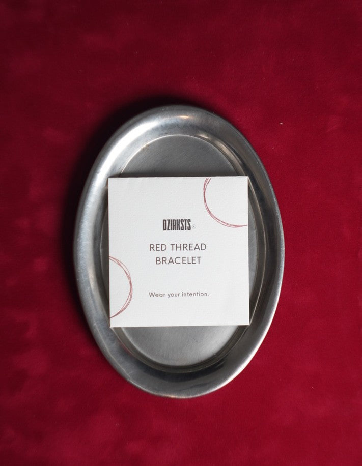 DZIRKSTS RED THREAD bracelet