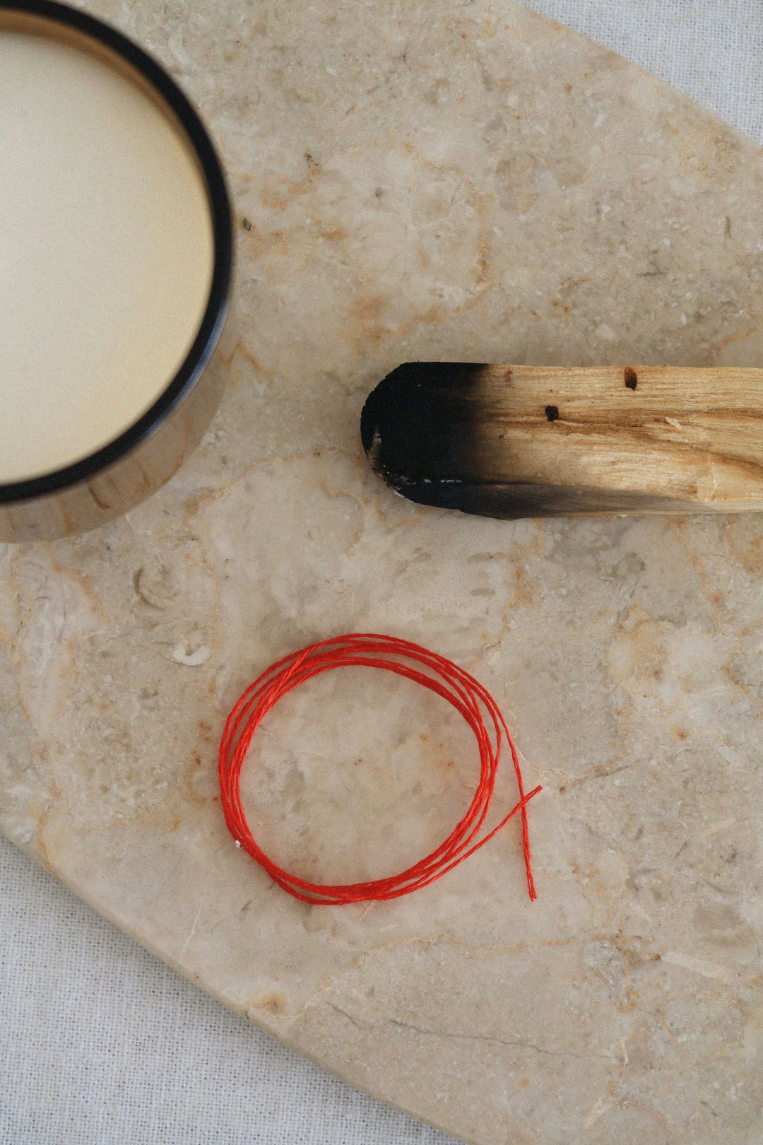 DZIRKSTS RED THREAD bracelet