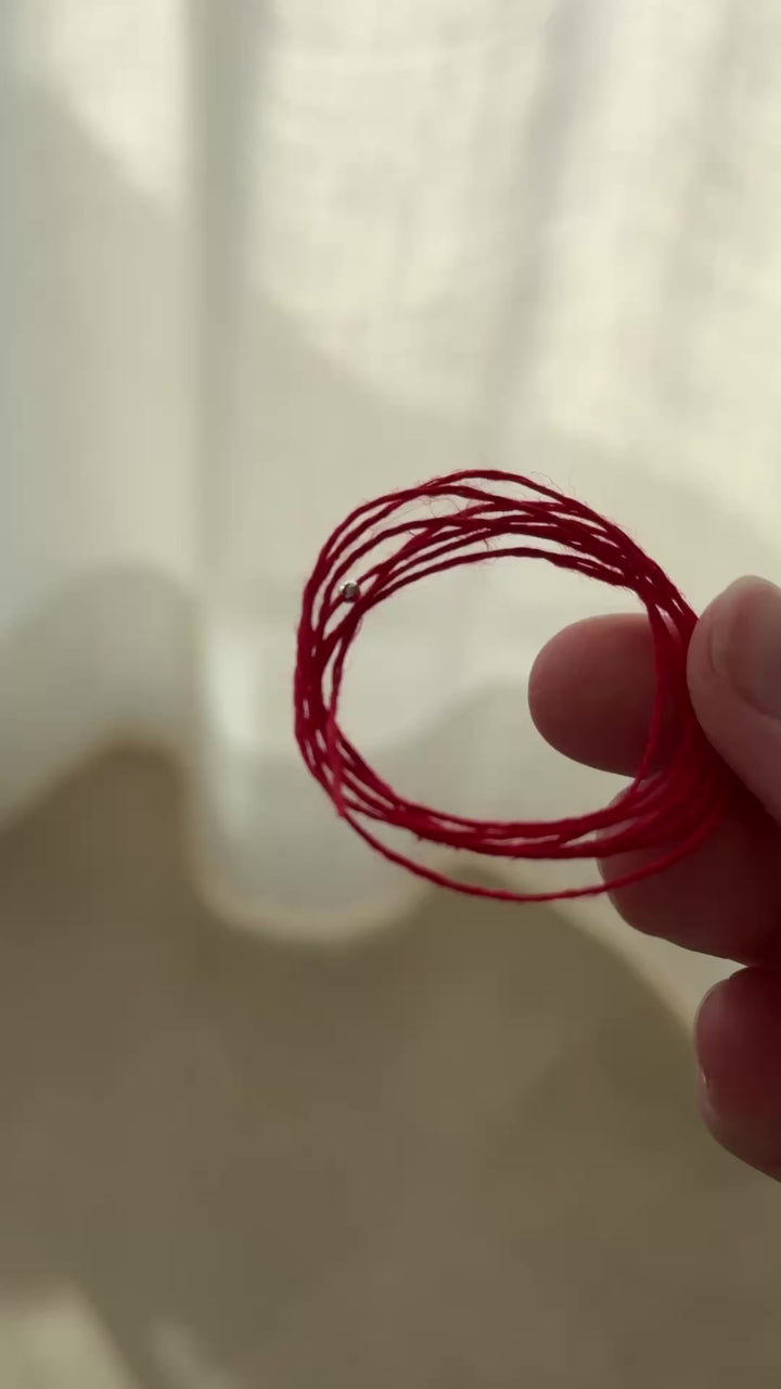 DZIRKSTS RED THREAD bracelet